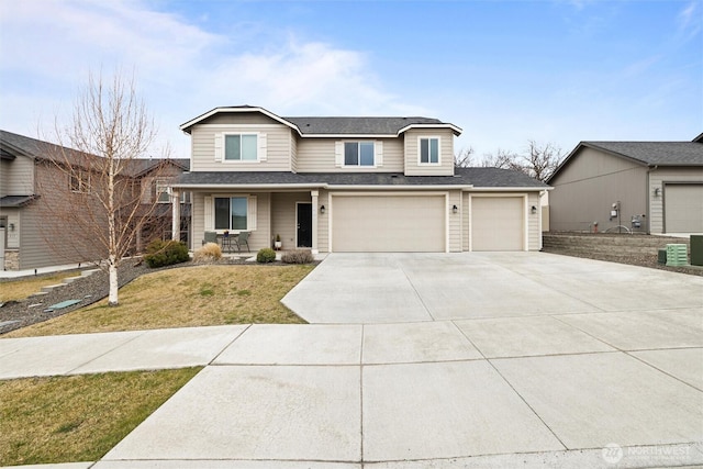 traditional home with concrete driveway, a porch, a front lawn, and roof with shingles