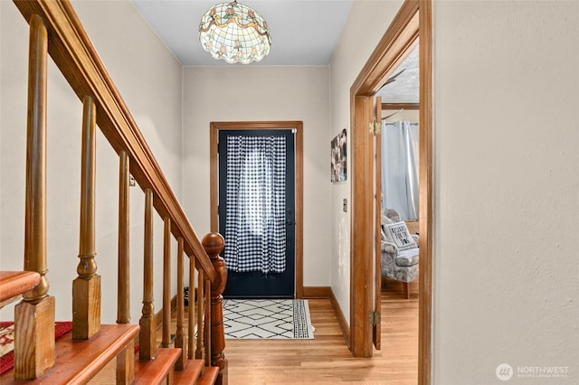 foyer entrance with light hardwood / wood-style floors