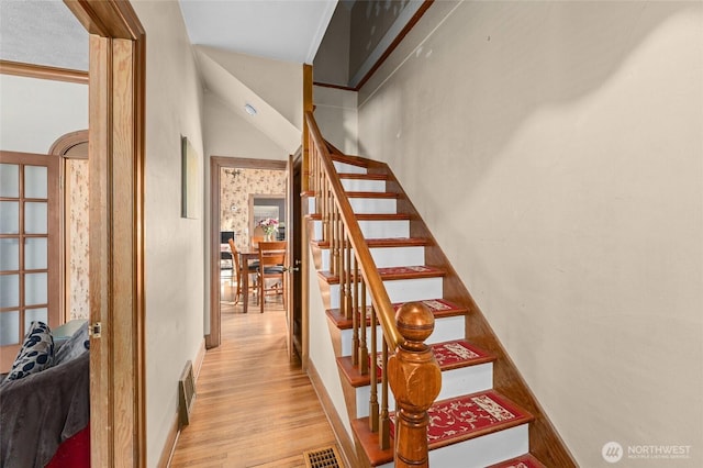 stairs with wood-type flooring