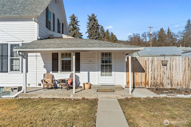 view of front of home with a patio and a front yard