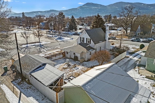 snowy aerial view with a mountain view