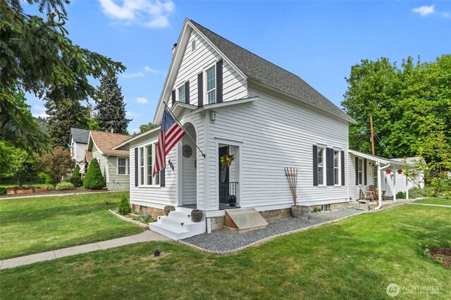 404 N Maple St, Colville, WA 99114 - view of property exterior featuring a yard and a shingled roof