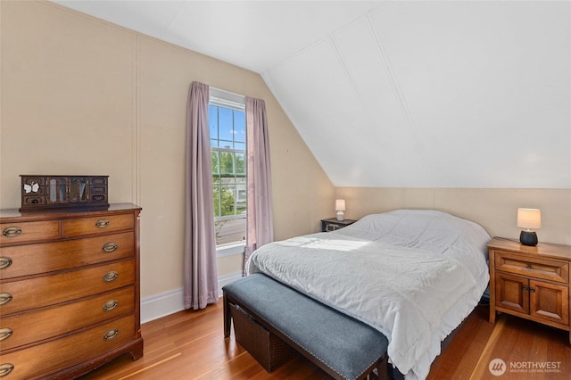 404 N Maple St, Colville, WA 99114 - bedroom featuring lofted ceiling, light wood-style flooring, and baseboards