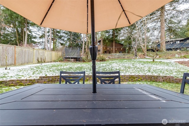 snow covered deck featuring a trampoline