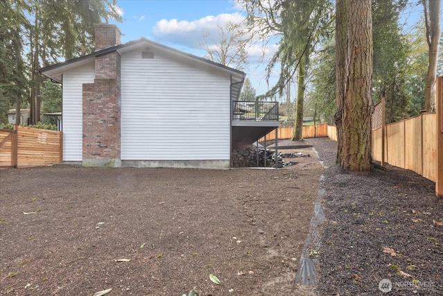 view of property exterior with a deck