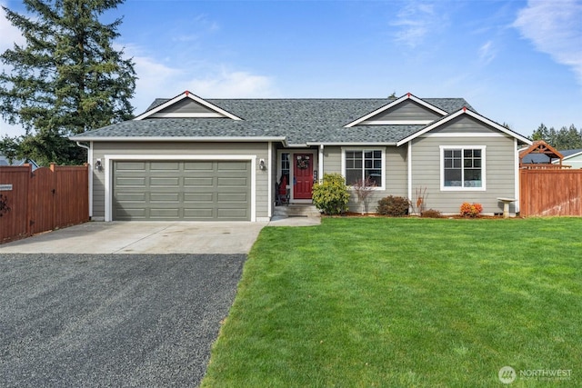 ranch-style house with a garage, fence, driveway, roof with shingles, and a front lawn