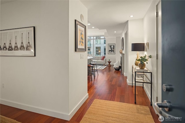 corridor featuring dark hardwood / wood-style flooring