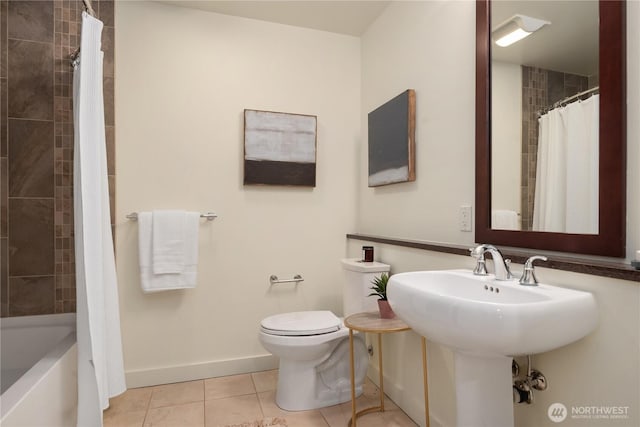 bathroom featuring tile patterned flooring, sink, and toilet