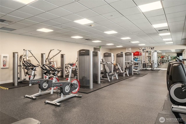 exercise room with a drop ceiling