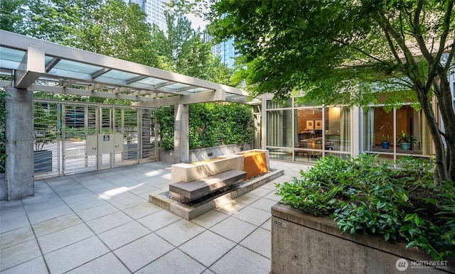 view of patio / terrace with an outdoor fire pit