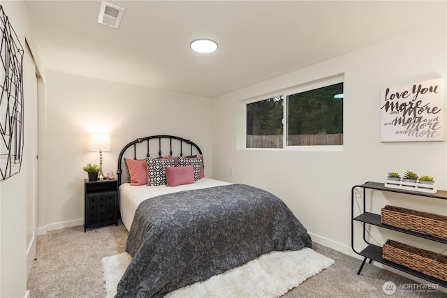 bedroom with light carpet