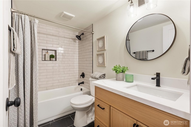 full bathroom featuring vanity, toilet, tile patterned flooring, and shower / tub combo