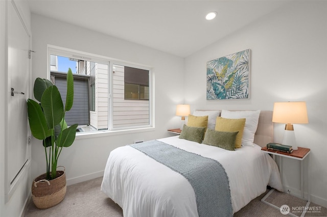 bedroom with light colored carpet