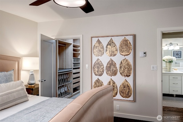 bedroom featuring dark wood-style floors, ceiling fan, and baseboards