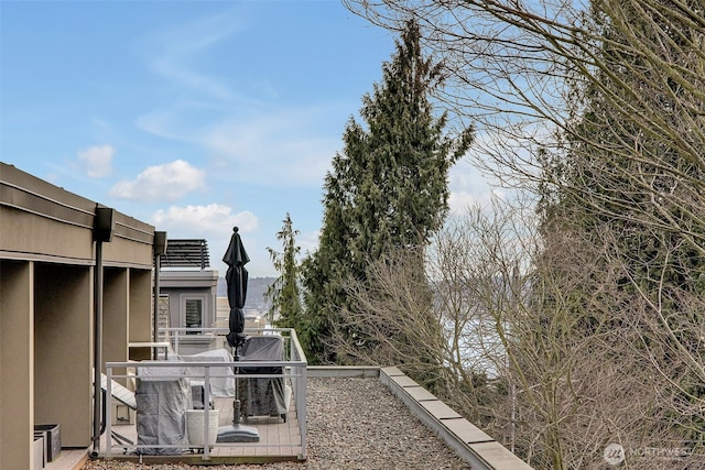 view of property exterior featuring a balcony and stucco siding