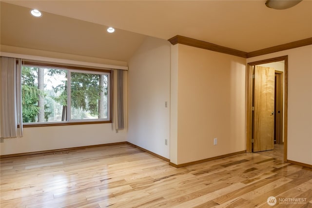 unfurnished room featuring recessed lighting, vaulted ceiling, light wood-style flooring, and baseboards