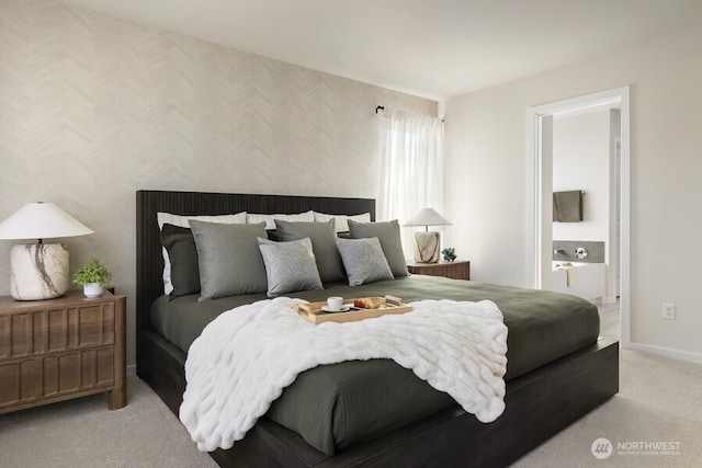 carpeted bedroom with ensuite bathroom