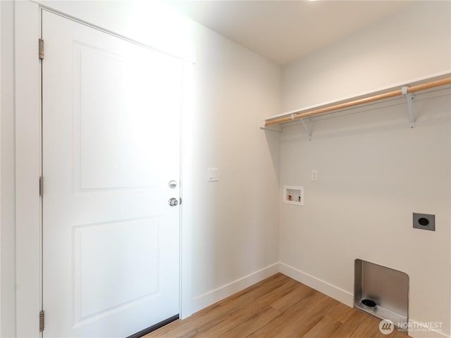 laundry area with hookup for a washing machine, hookup for an electric dryer, and light wood-type flooring