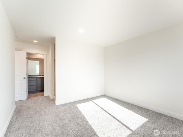 unfurnished bedroom with light colored carpet