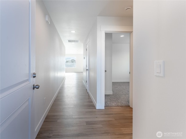 corridor featuring hardwood / wood-style flooring