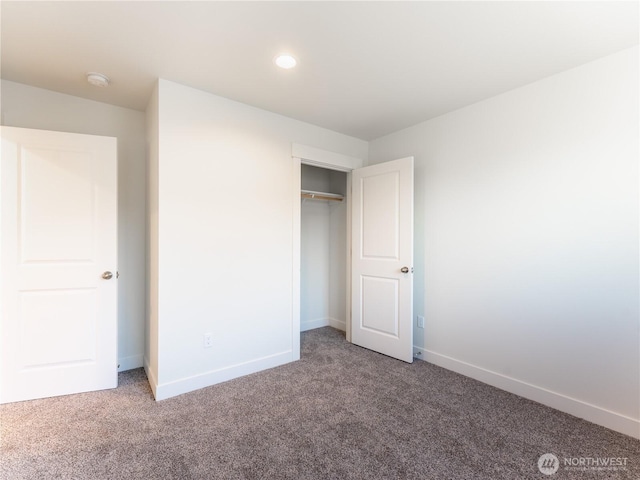 unfurnished bedroom featuring a closet and carpet