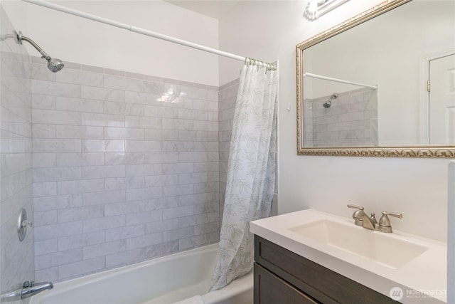 bathroom with shower / bath combo and vanity