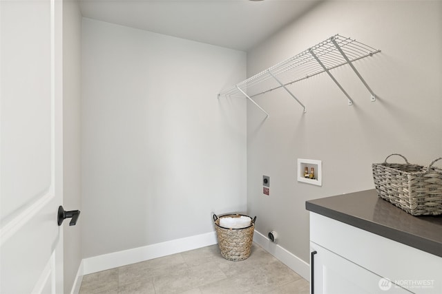 laundry room featuring cabinets, hookup for a washing machine, and hookup for an electric dryer