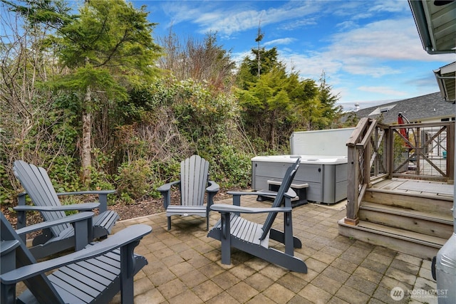 view of patio / terrace with a hot tub