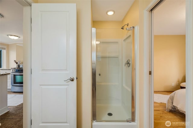 ensuite bathroom with a stall shower and connected bathroom
