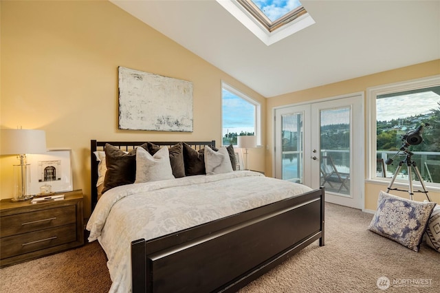 bedroom with light carpet, vaulted ceiling with skylight, access to outside, and french doors