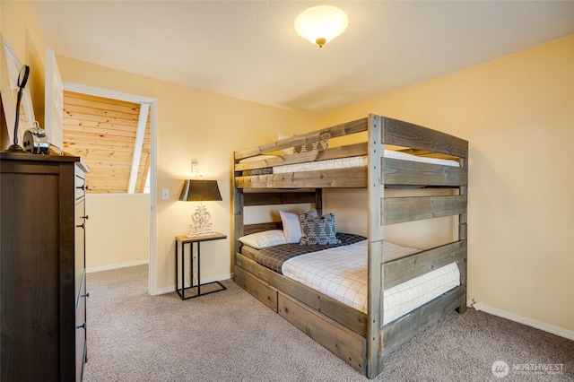 bedroom featuring carpet flooring and baseboards