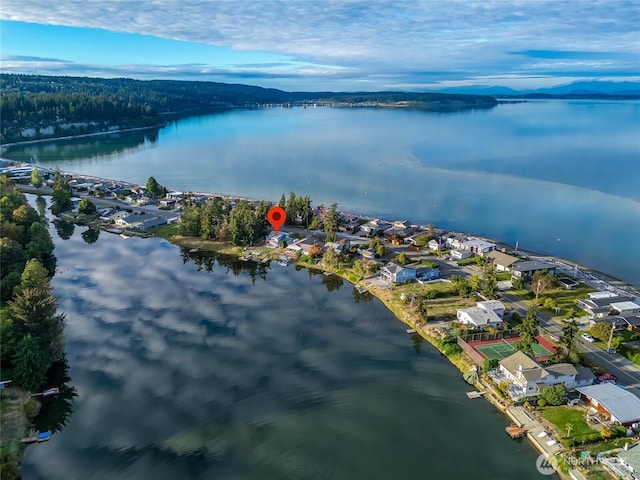 birds eye view of property with a residential view and a water and mountain view
