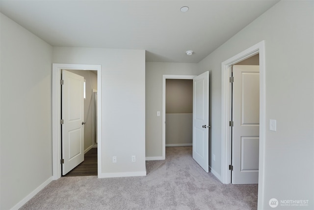 unfurnished bedroom with light colored carpet