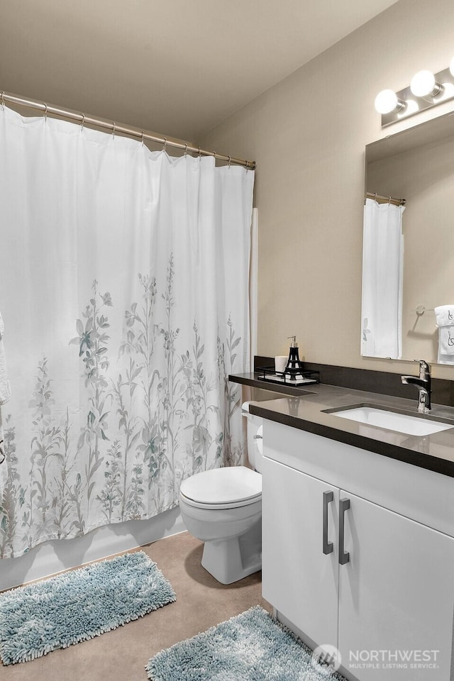 full bathroom featuring vanity and toilet