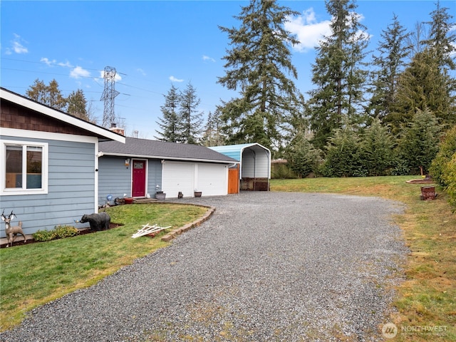 view of front facade featuring a chimney, driveway, a garage, a front yard, and a carport