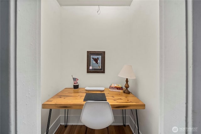 office space with baseboards and wood finished floors