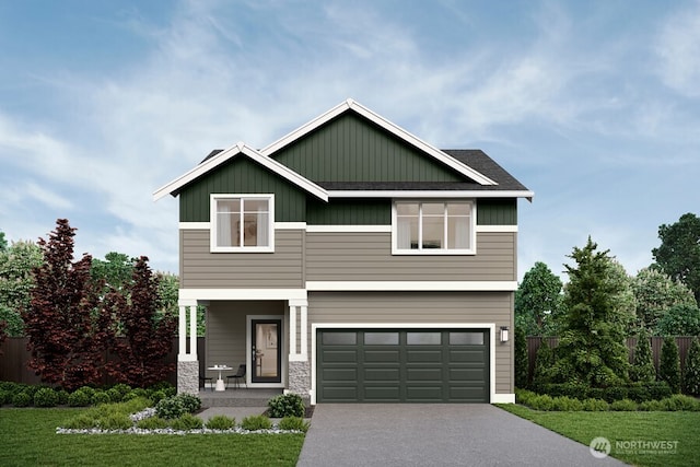 craftsman house featuring a garage and a front lawn