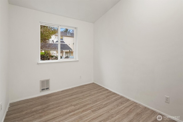 unfurnished room featuring light hardwood / wood-style flooring