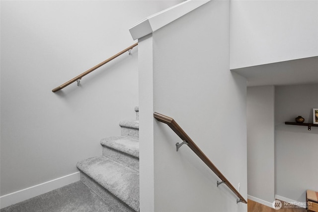 staircase featuring baseboards