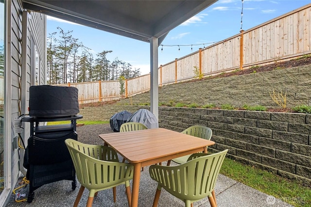 view of patio / terrace with outdoor dining space and a fenced backyard