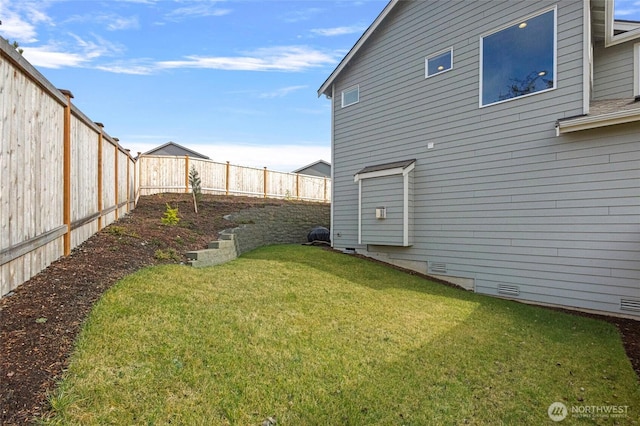 view of yard featuring a fenced backyard