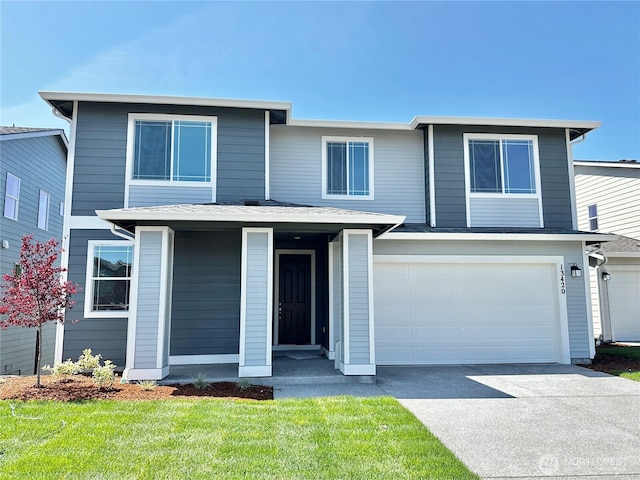 13420 187th Street Ct E Unit 21, Puyallup, WA 98374 - view of front of property with driveway, an attached garage, and a front lawn