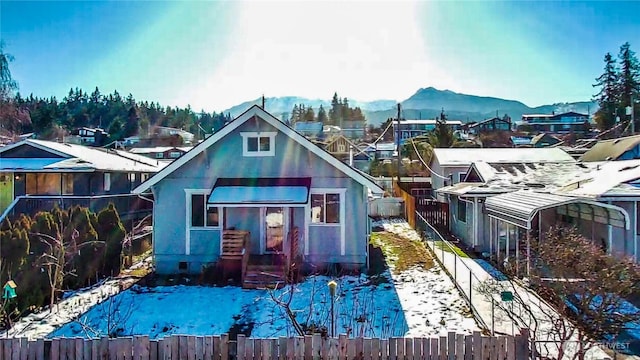 back of house with a mountain view