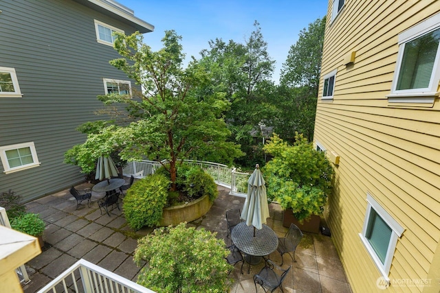 view of yard featuring outdoor dining area and a patio area