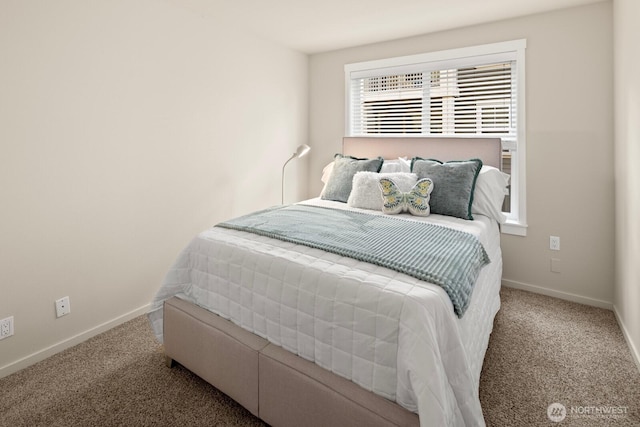 carpeted bedroom featuring baseboards