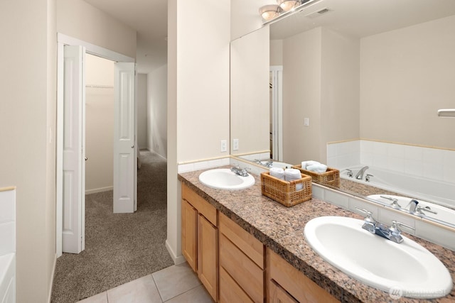 bathroom featuring a sink, visible vents, and a bath