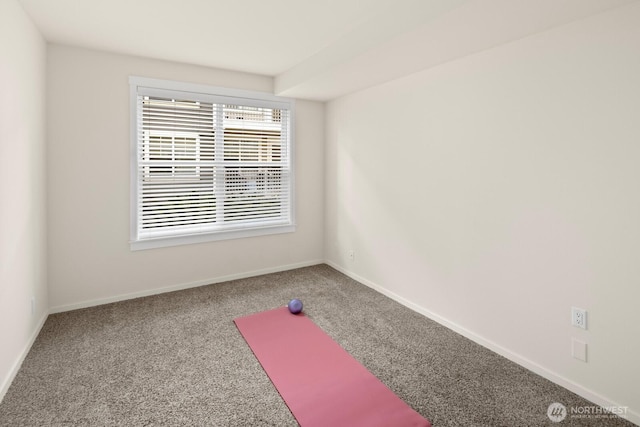 exercise area with carpet flooring and baseboards