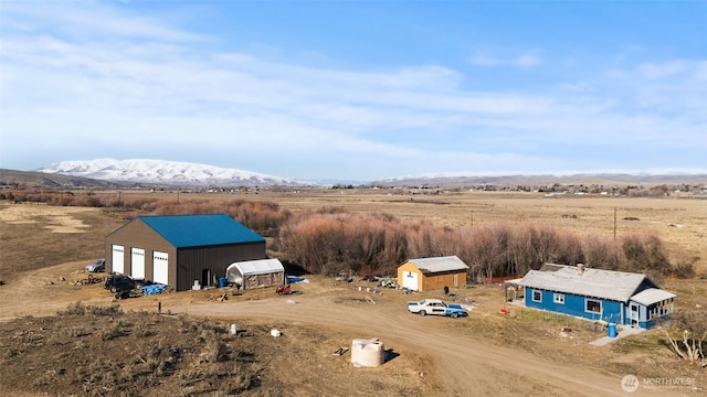 aerial view featuring a rural view and a mountain view