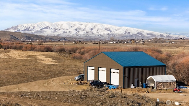 view of outbuilding featuring a garage and a mountain view