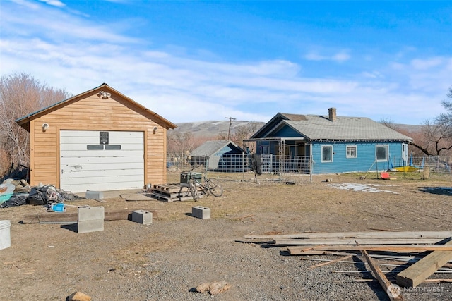 exterior space featuring an outbuilding and a garage